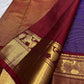 Detailed Arakku Red Kanchipuram pallu with dense geometric gold zari field and ornamental woven registers.