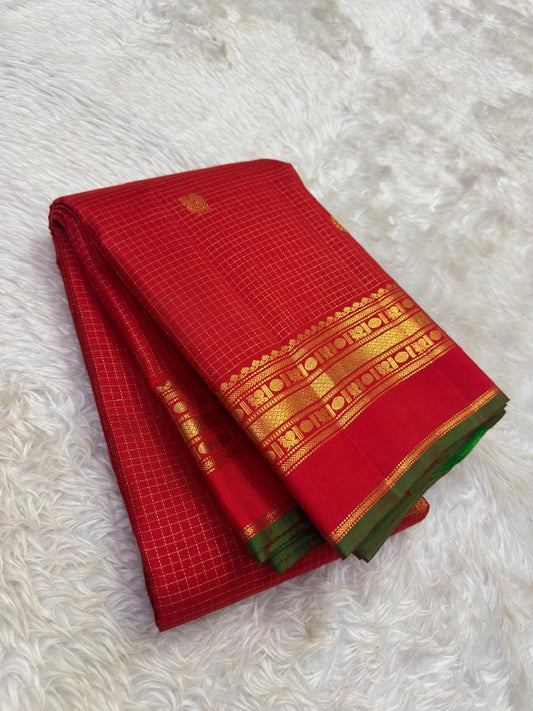 Arakku Red Handwoven Pure Silk Kanchipuram Saree with Zari Kattam Floral Butta and Kaal Irangiya Border