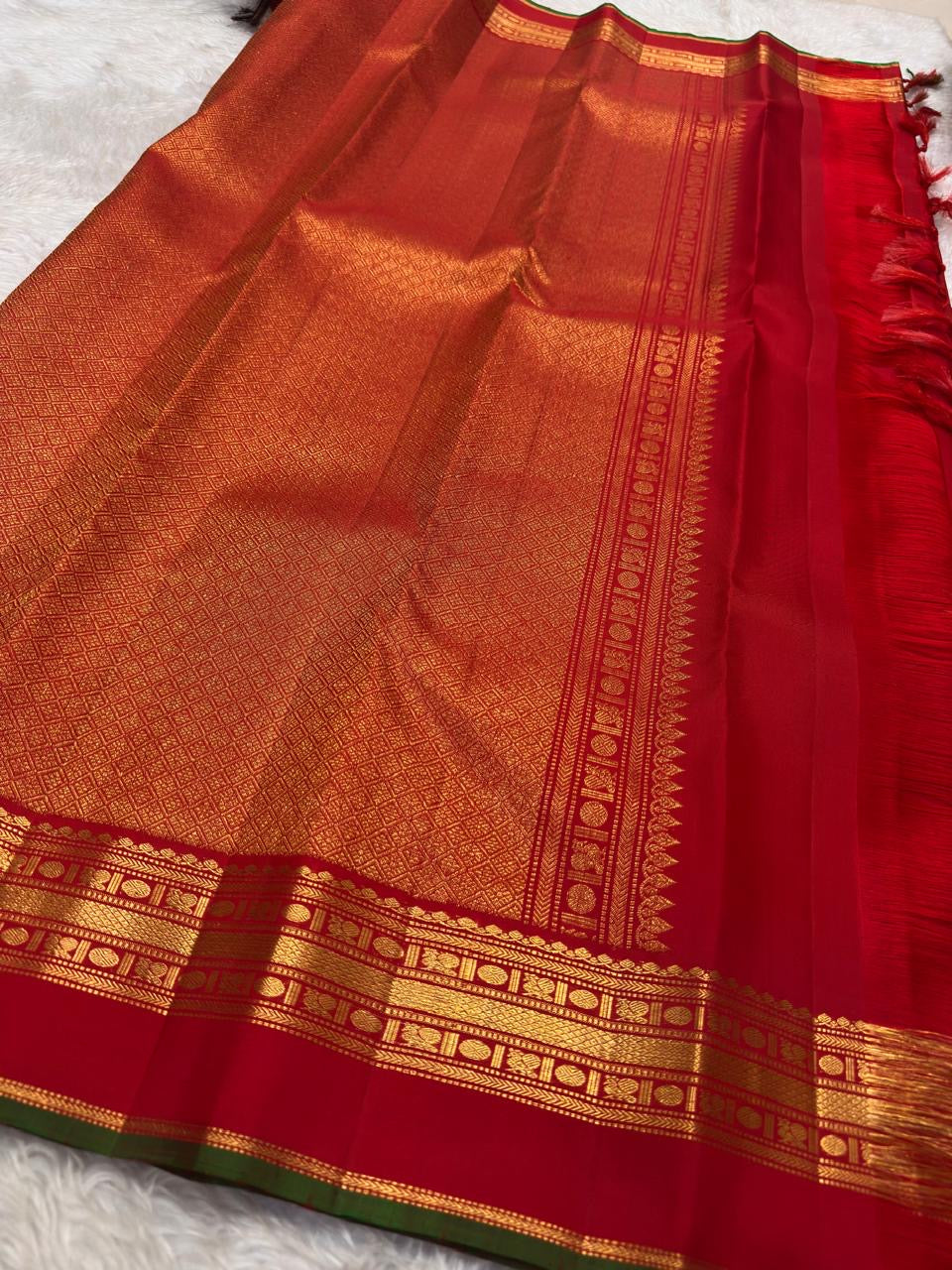 Arakku Red Handwoven Pure Silk Kanchipuram Saree with Zari Kattam Floral Butta and Kaal Irangiya Border