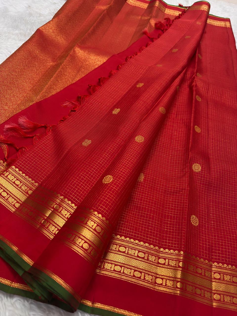Arakku Red Handwoven Pure Silk Kanchipuram Saree with Zari Kattam Floral Butta and Kaal Irangiya Border