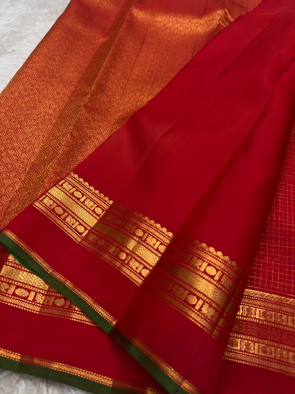 Arakku Red Handwoven Pure Silk Kanchipuram Saree with Zari Kattam Floral Butta and Kaal Irangiya Border