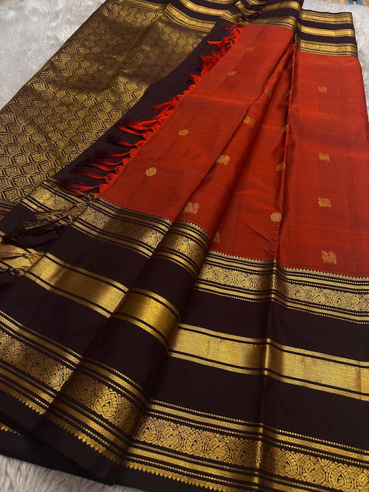 Terracotta Orange-Red pure silk Kanchipuram body with spaced gold zari buttas