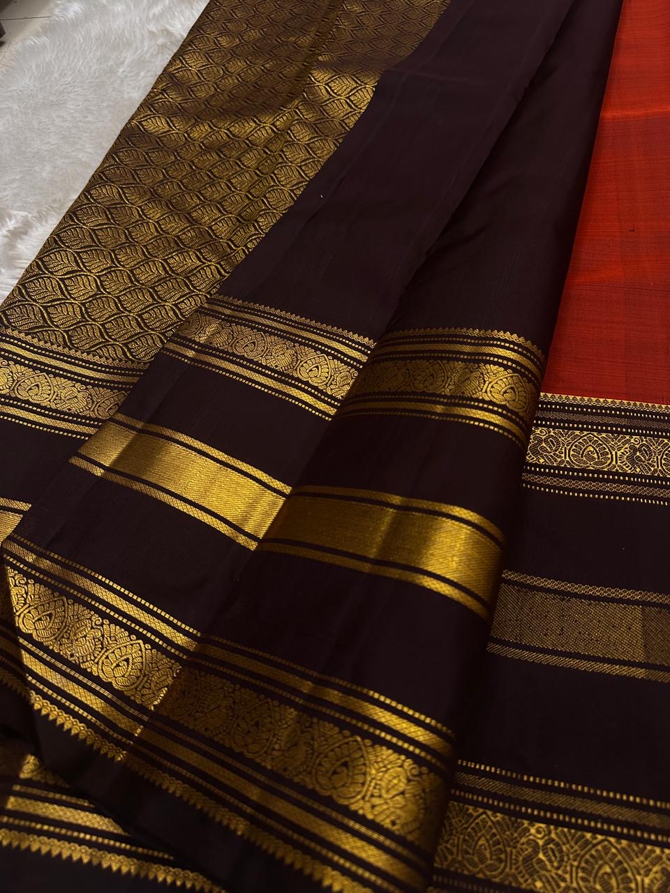 Full view of the Terracotta Orange-Red Pure Silk Kanchipuram Varisaipet Saree with Kaapi Kottai Gold Zari Border