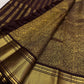 Deep brown silk body detail showing elegant vertical gold zari lines.