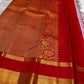 Ash Lilac Kanjivaram silk saree with geometric floral gold zari buttas