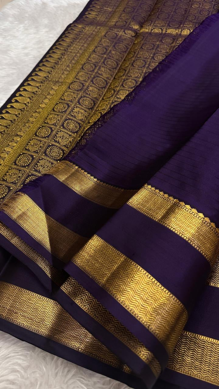 Aubergine border and pallu detail on orchid purple KanchiPattu silk saree