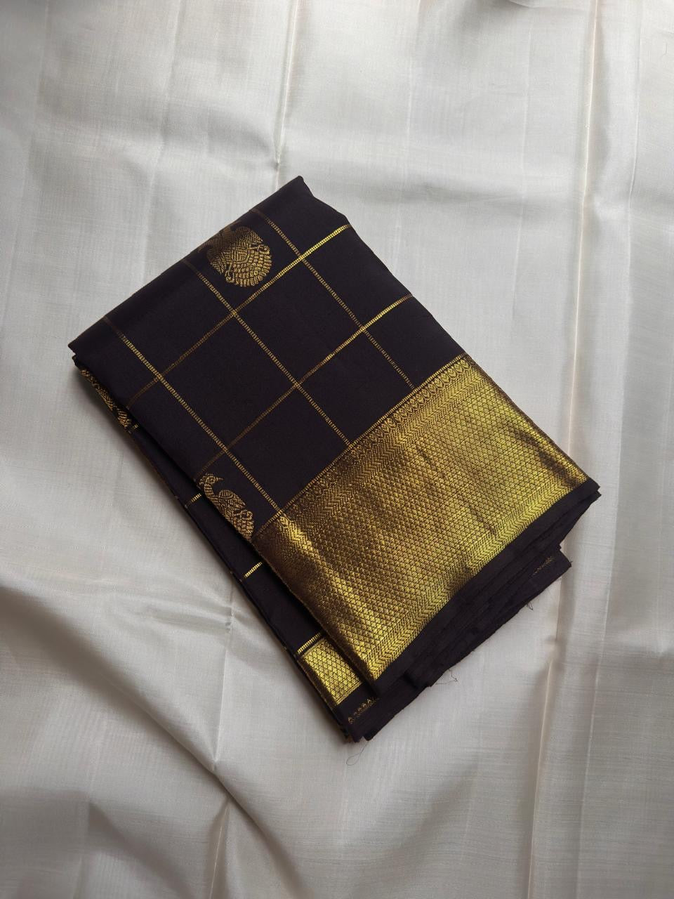 Deep Coffee Brown Gandaberunda Zari Kattam Kanjivaram saree with antique gold border, styled shot.