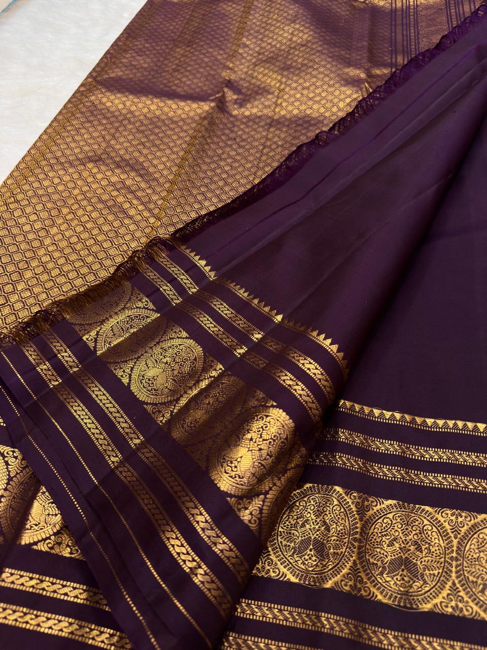 Dusky Aubergine Handwoven Pure Silk Kancheepuram Saree with Mayil Zari Buttas and Antique Pon Zari Border
