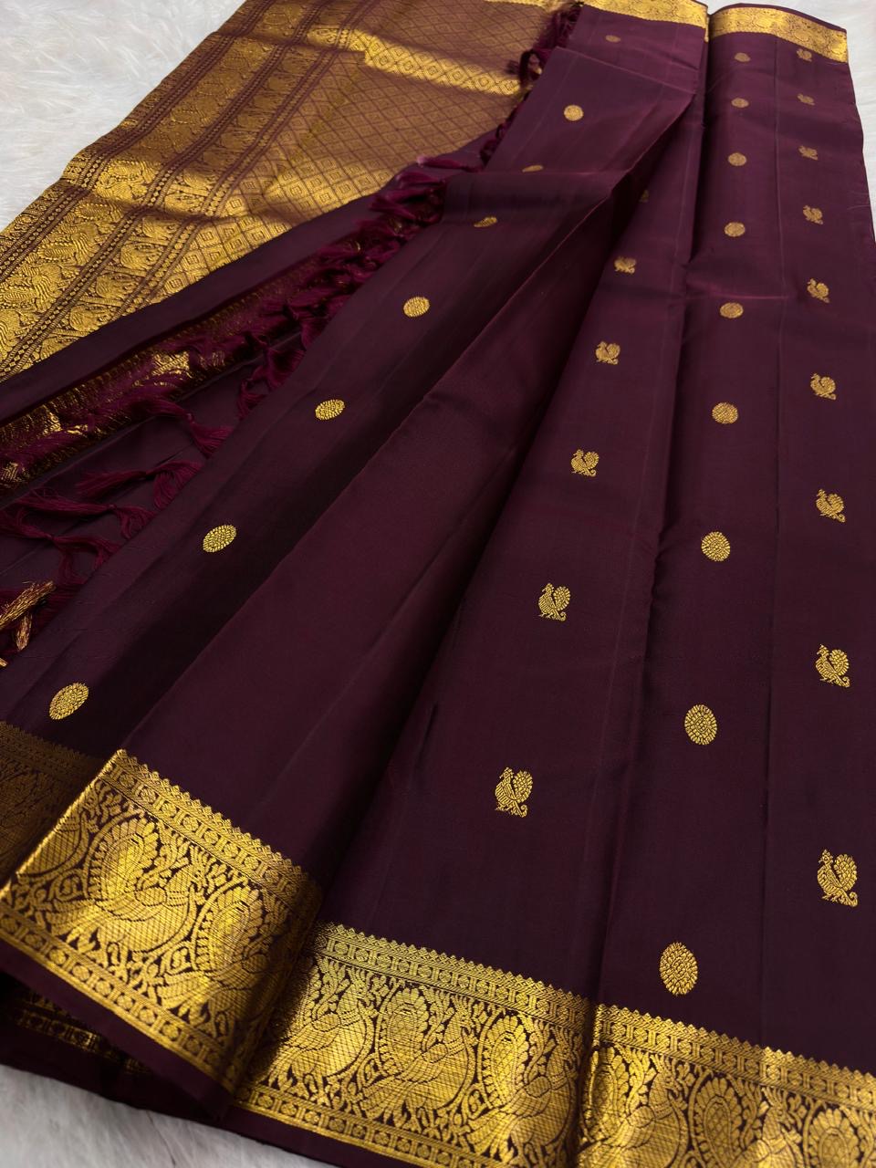 Aubergine Kanjivaram silk saree with grand antique gold zari woven pallu
