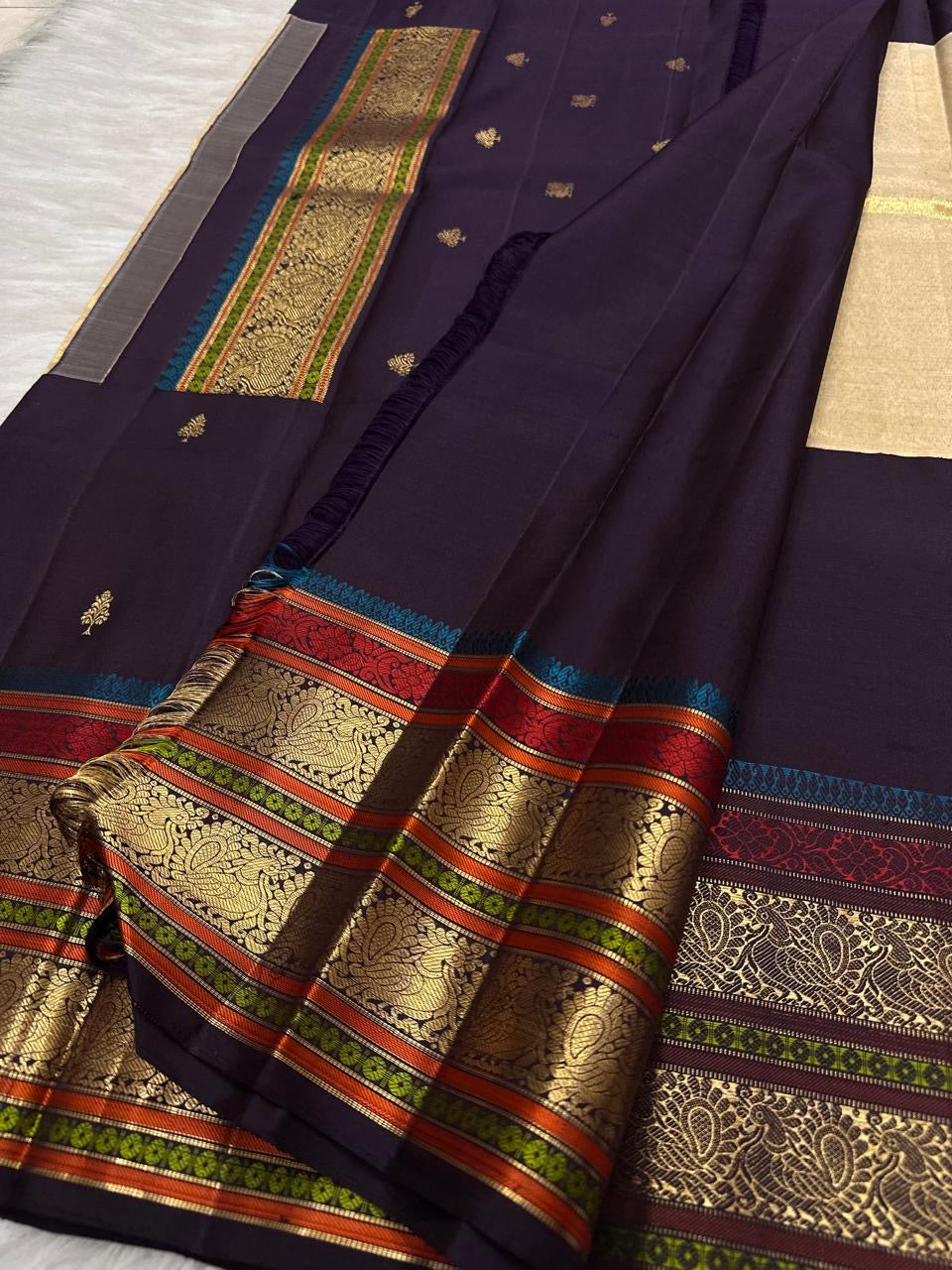Layered multicolour silk thread and gold zari border on Kanchipuram saree