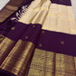 Deep Aubergine Purple Kanchipuram silk with floral and leaf zari buttas.