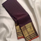 Deep Aubergine Purple pure silk Kanchipuram saree with antique-gold woven detailing.