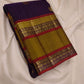 Folded view of aubergine purple and ponvandu muted yellow rettapet korvai Kanchipuram silk saree — Idam Living