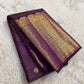 Deep Aubergine Purple Pure Silk Kanchipuram Zari Kattam saree with gold buttas, broad ornate zari border and tasselled pallu.
