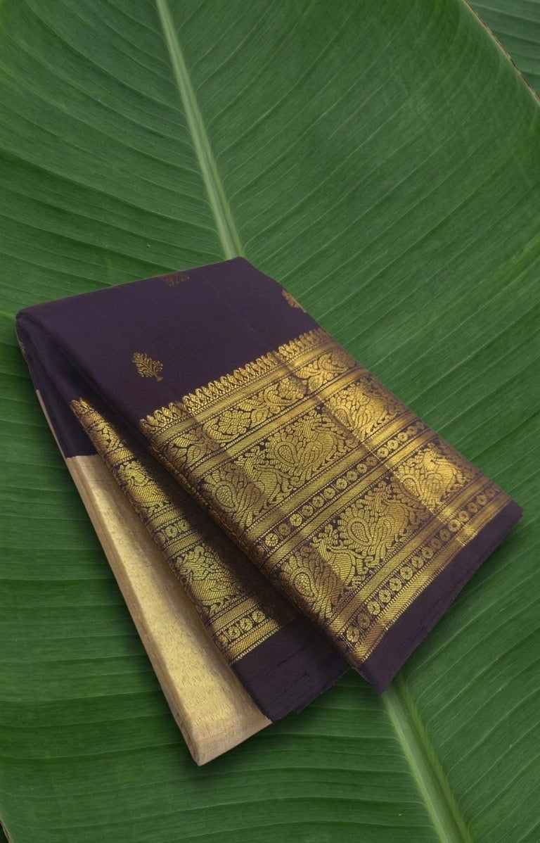 Pure Kanchipuram silk saree in aubergine purple with antique gold peacock zari border