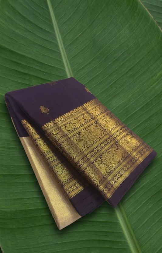 Pure Kanchipuram silk saree in aubergine purple with antique gold peacock zari border