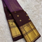 Aubergine purple Kanjeevaram silk saree with antique gold yali border detail