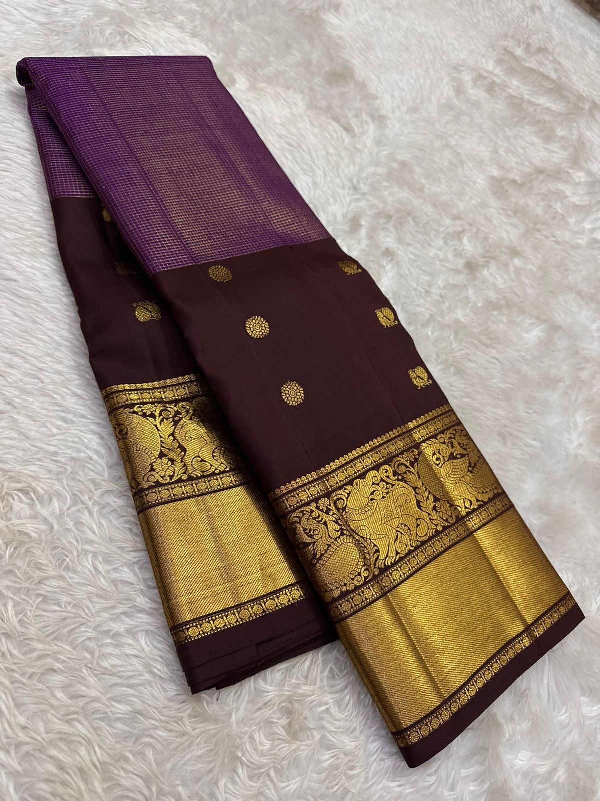 Aubergine purple Kanjeevaram silk saree with antique gold yali border detail