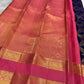 Kathiripoo Pure Silk Kanchipuram contrasted with saturated lotus-pink silk and warm traditional gold zari.