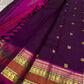 Aubergine and raspberry pink colour pairing close-up on Kanjipuram silk saree