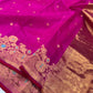Close view of the purplish pink Chanderi saree's antique-gold floral border with turquoise-blue accents and gold-toned pallu