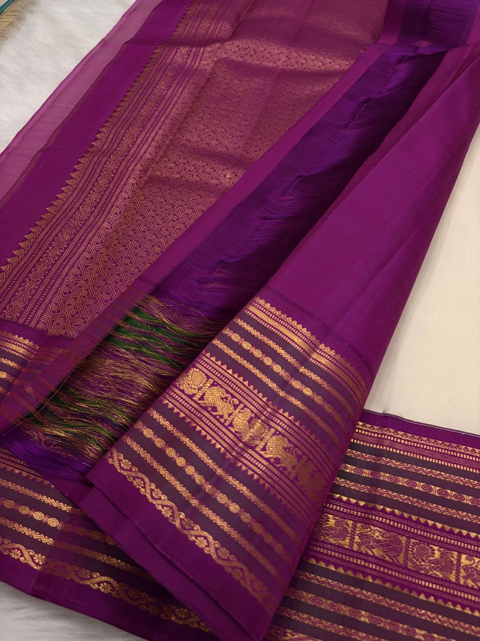 Kanjivaram Korvai saree peacock zari border detail, pure mulberry silk