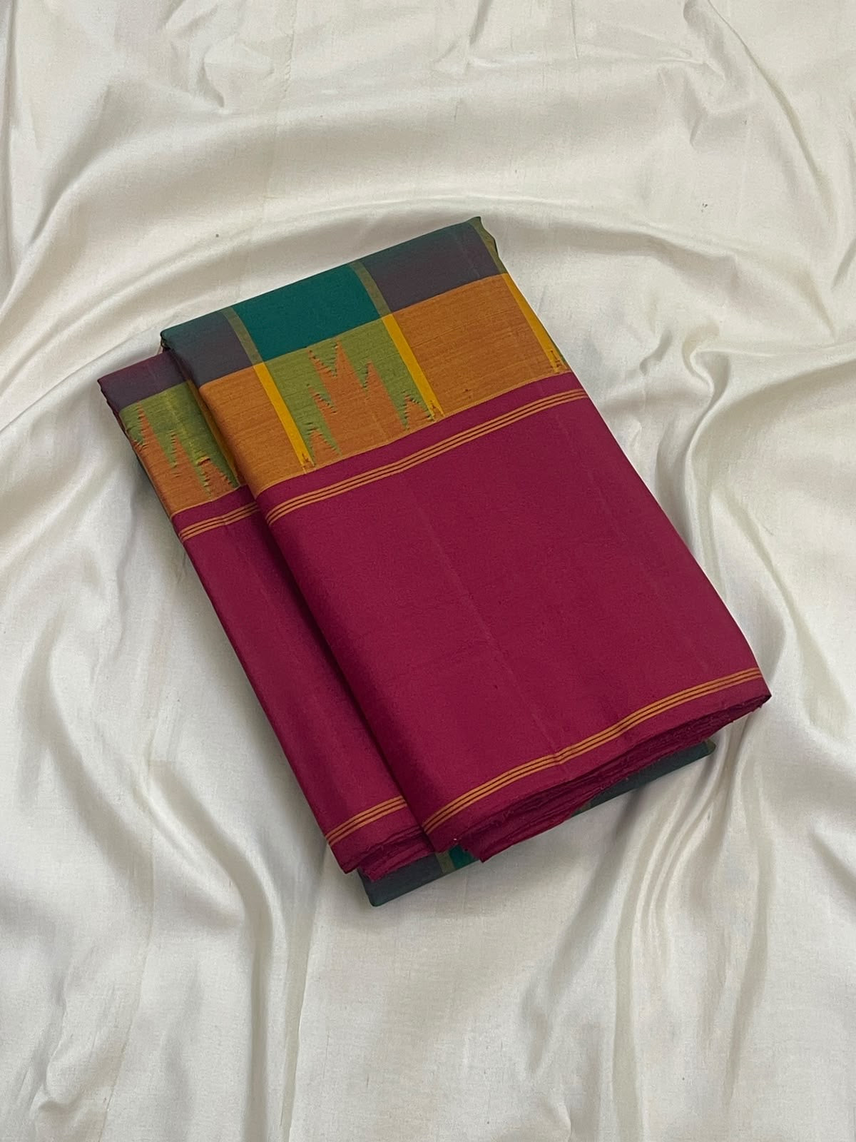 Maragatham green Kanchipuram silk saree, multicolour silk border with orange, pink and purple registers