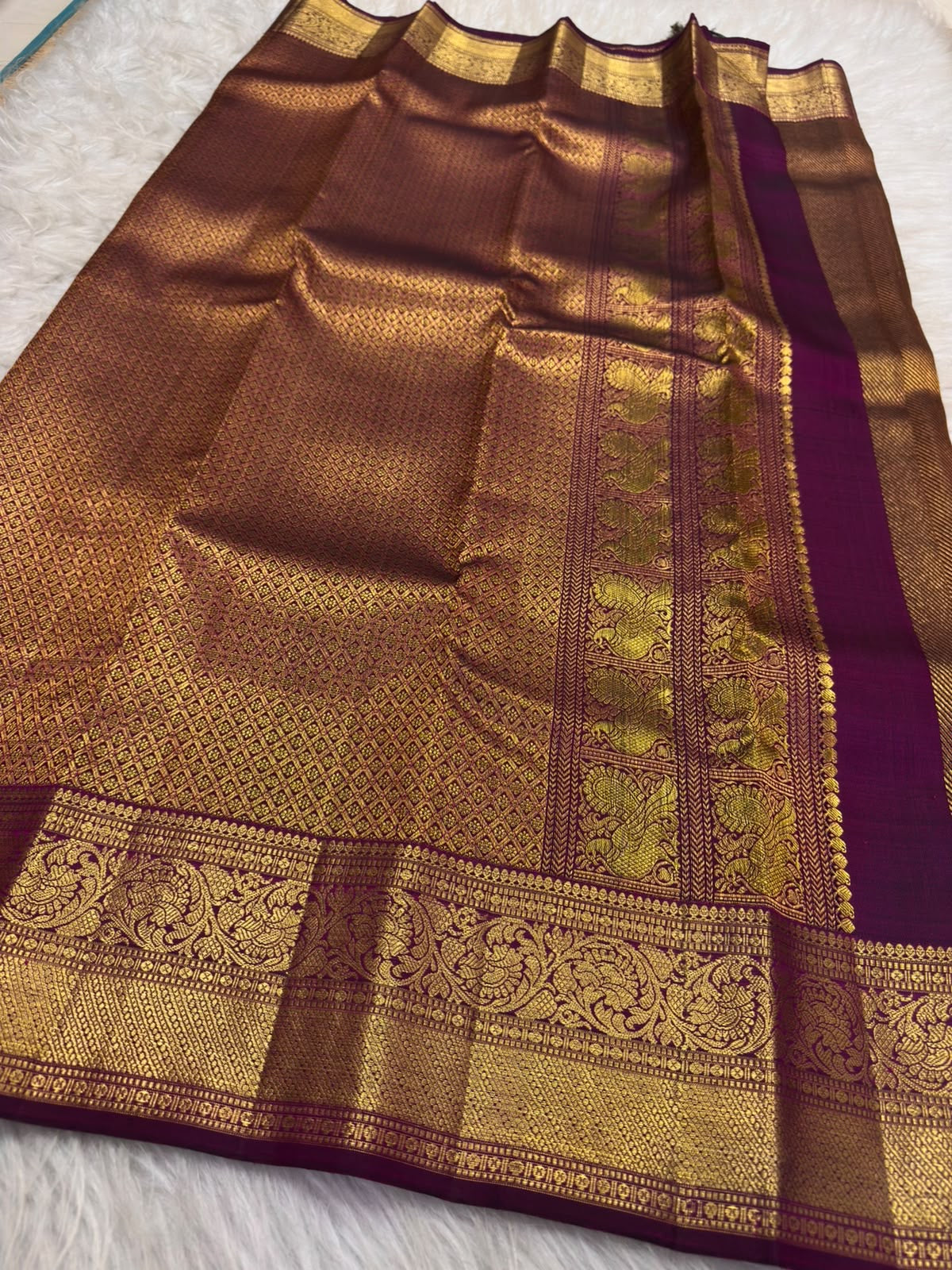 Handwoven Deep Plum Bronze Kanchipuram silk saree, zari texture, twin peacock border panels