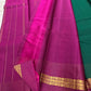 Emerald Green and Vadamalli Magenta lightweight Kanchipuram silk saree, spaced buttas and scrolling floral zari border; body detail