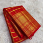 Vermilion Red Gold Checks pure silk Kanchipuram saree, woven buttas, showing brilliant kumkum red, warm vermilion orange highlights and glowing yellow-gold zari