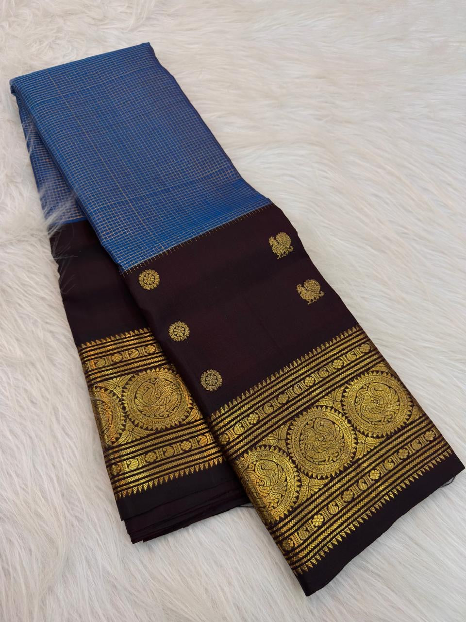 Azure Blue handwoven pure silk Kanjivaram Butta saree with Deep Kanchana Brown contrast.