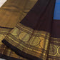 Grand Mayil peacock border on Azure Blue and Kanchana Brown Kanjivaram saree.