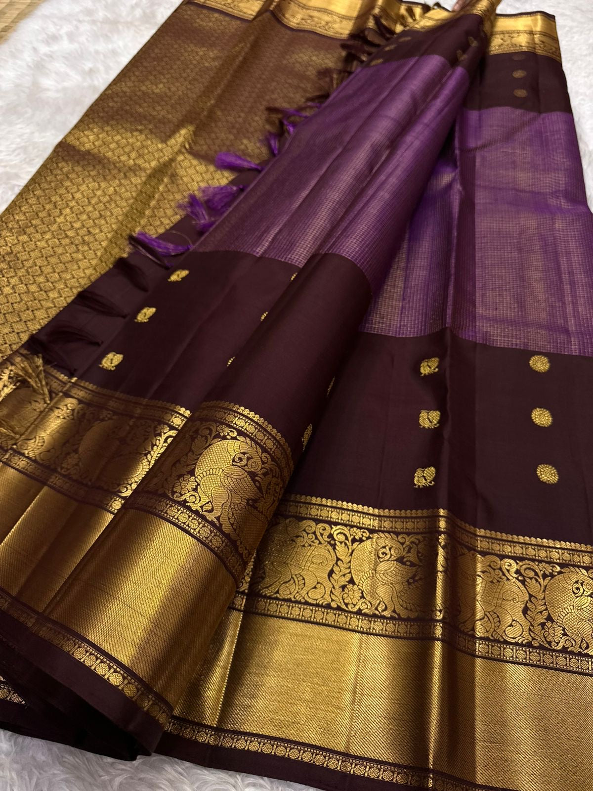 Rich coffee brown pure Kanchipuram silk saree with zari kattam weave – folded view