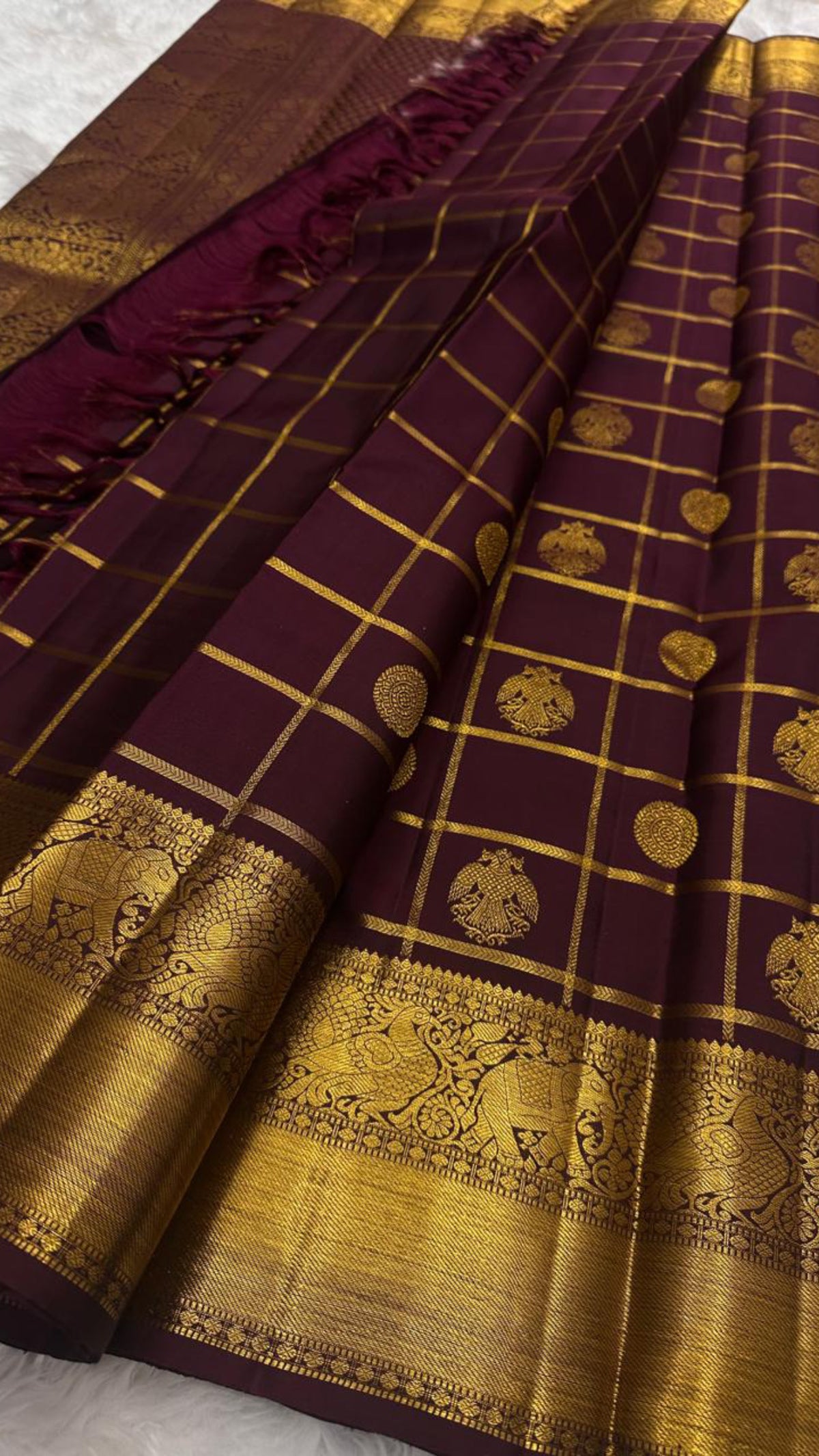 Burgundy brown Kanchipuram silk saree with deep Kanchana purple undertone and gold zari kattam checks