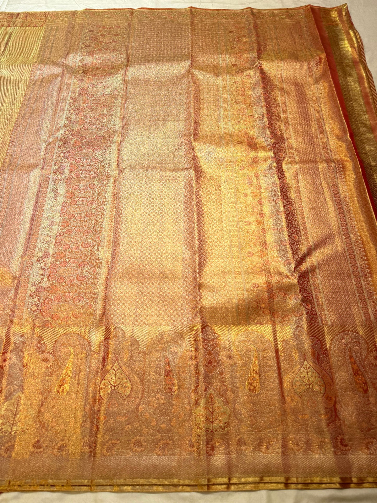 Handwoven Butta fusion saree with ornate Banarasi-style antique-gold paisley border.