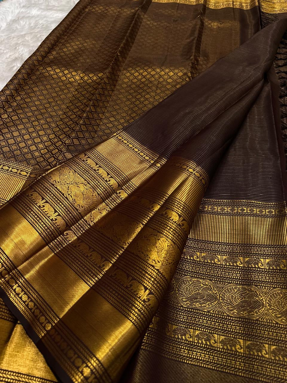 Traditional Kanchipuram saree in walnut Kanchana brown with luminous antique gold zari kattam grid