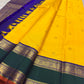 Manjal yellow Kanchipuram silk with emerald green contrast border