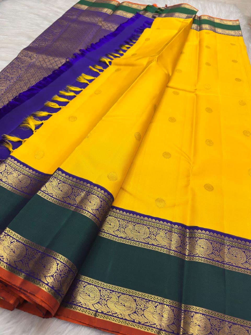 Manjal yellow Kanchipuram silk with emerald green contrast border