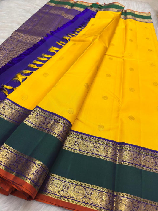 Manjal yellow Kanchipuram silk with emerald green contrast border