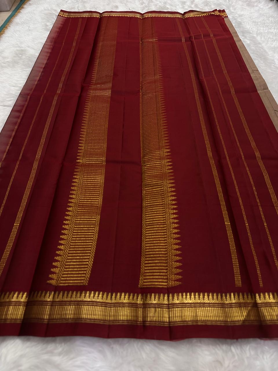 Flat view of pure Kanchipuram silk saree pallu showing repeated vertical gold zari bands shipped from New Jersey USA