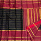 Close view of fine Veldhari zari lines running along deep black Kanjipuram silk