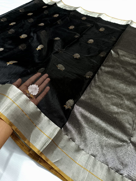 Small silver-toned woven motifs on deep black silk