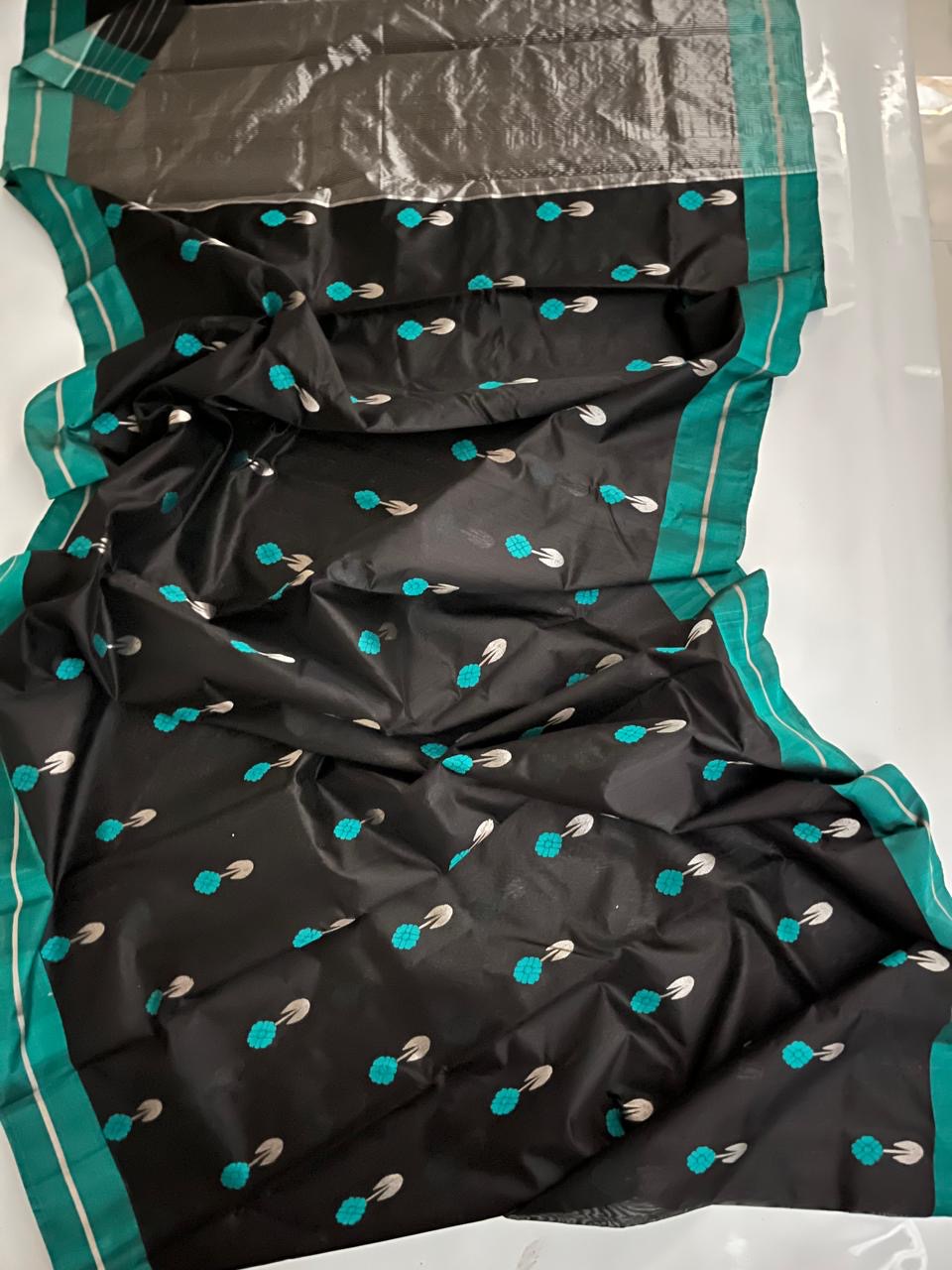 Turquoise and silver-toned woven details on midnight-black Chanderi silk