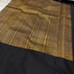 Silver zari paisley panel close-up on black ground