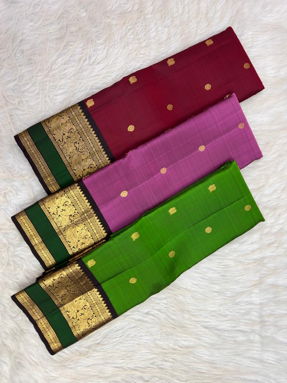 Pure silk magenta Butta saree with spaced floral and maanga-style gold motifs