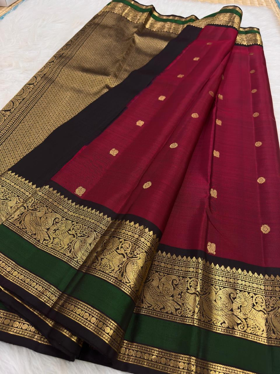 Fresh-green Butta KanchiPattu saree with black-green peacock zari border