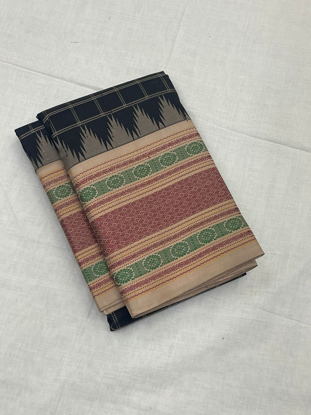 Dense kamalam and geometric motifs on multi-colour pattupet border of black Kanchipuram silk saree — Idam Living