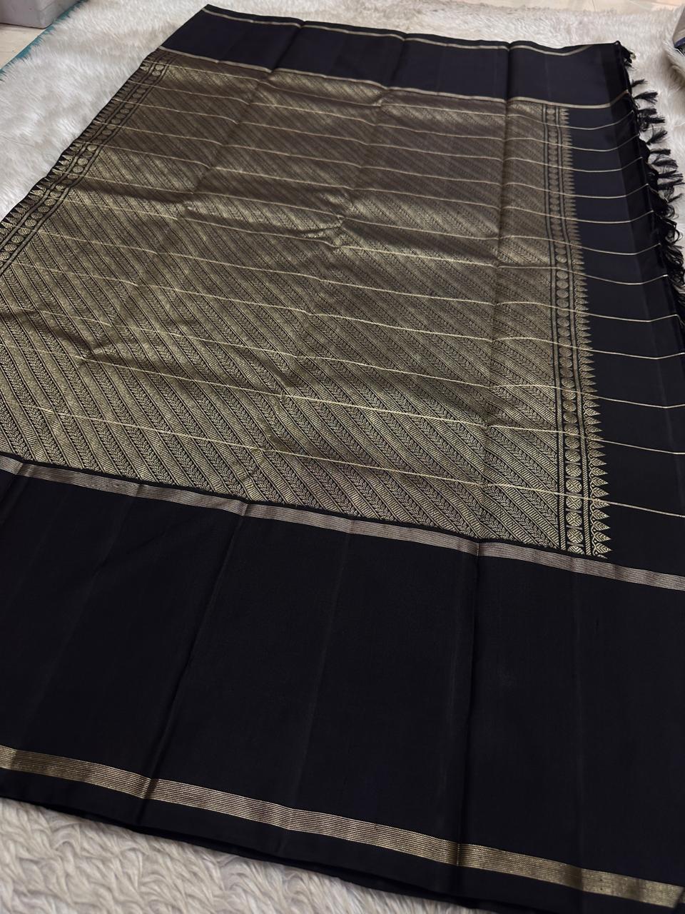 Black Pure Kanchipuram silk saree pallu with dense zari woven pattern and border, shipped from New Jersey USA.