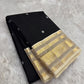 Black Kanchipuram silk saree with ivory buttas and antique gold zari border korvai weave folded view