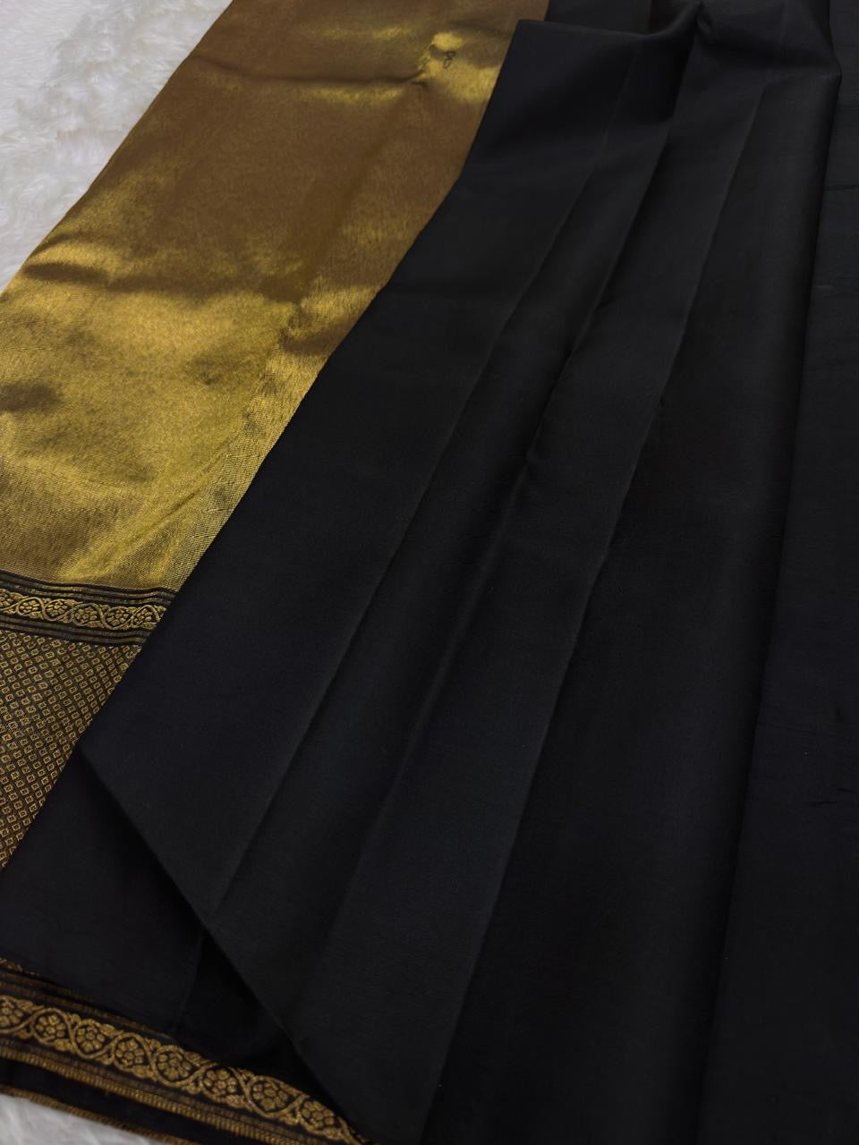 Close view of multicolour floral zari jaal woven across Midnight Black pure silk.